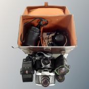A vintage camera case containing Pentax Asahi camera with lens,