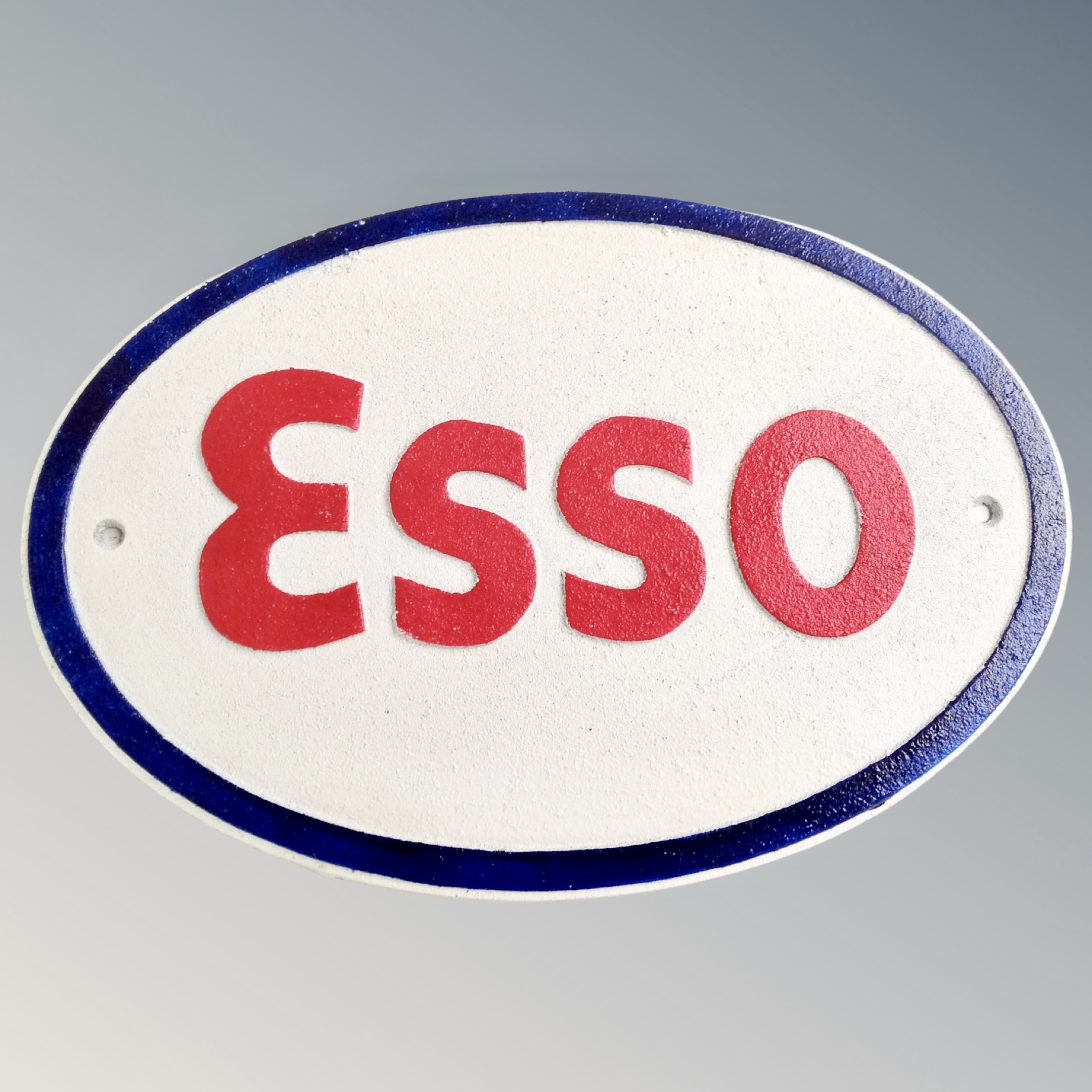 A cast iron wall plaque, Esso.