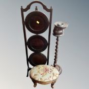 A barley twist smoker's stand together with a three tier folding cake stand and a tapestry