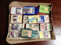 A box containing vintage card games and Top Trumps.