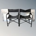 Two folding picnic chairs in bags, as new, together with two further folding directors style chairs.
