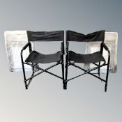 Two folding picnic chairs in bags, as new, together with two further folding directors style chairs.