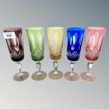 A harlequin set of five Bohemian cut to clear glass flutes