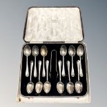A set of twelve silver teaspoons with sugar tongs, Sheffield 1931, 169.3g.