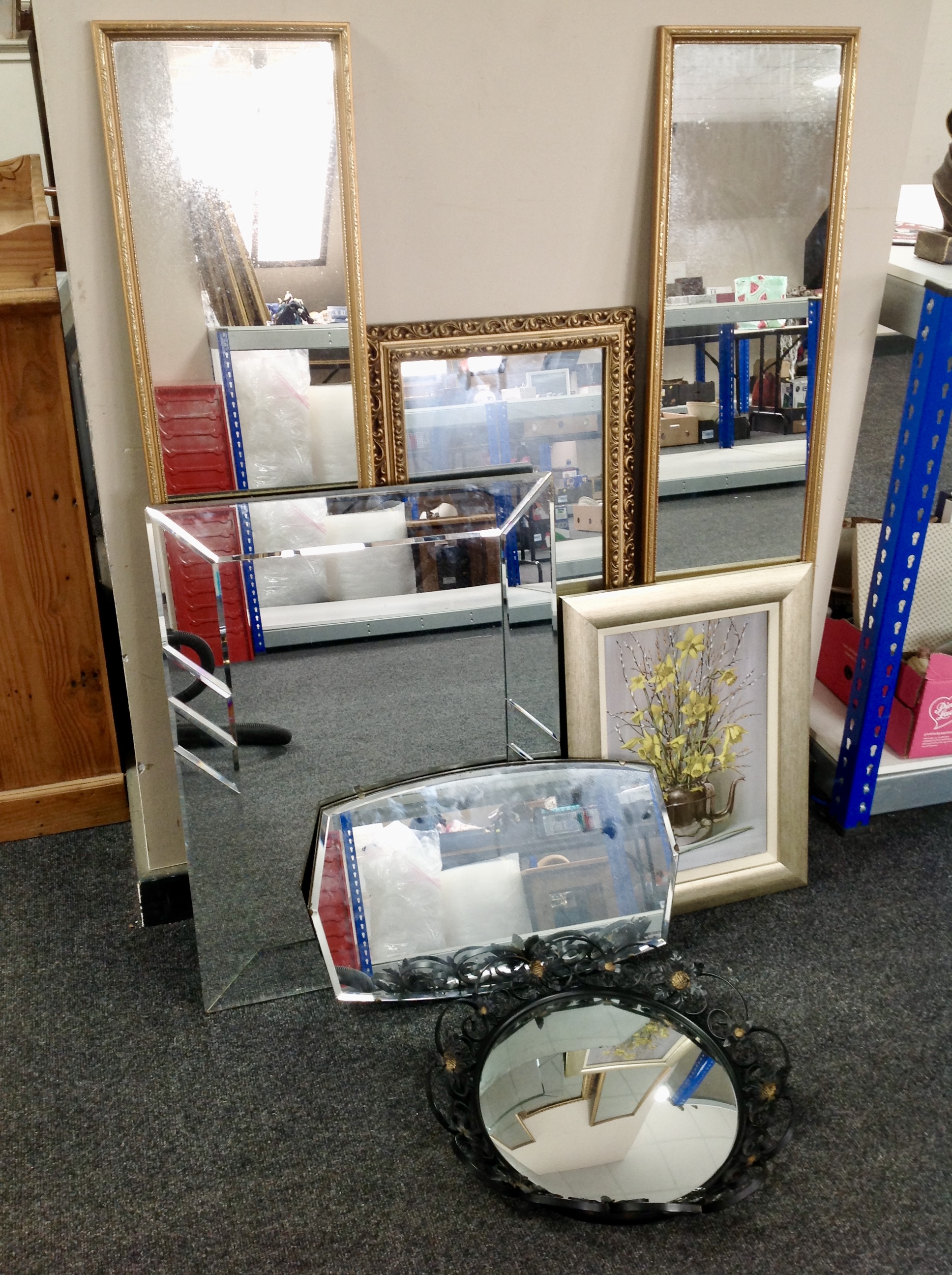 A 20th century wrought metal framed mirror together with five further mirrors and framed picture