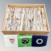 A box containing a large quantity of 20th century vinyl 7" singles including The Beatles, The Who,