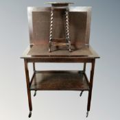 An Edwardian oak barley twist plant table together with a two tier turnover top card trolley.