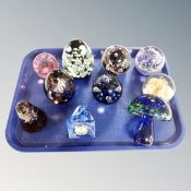 A tray of nine assorted glass paperweights, Caithness and Wedgwood,