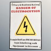 A cast iron wall plaque, railway electrocution safety notice.