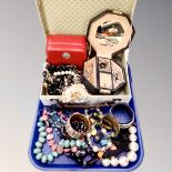 A tray containing jewellery boxes containing assorted costume jewellery, charm bracelets,