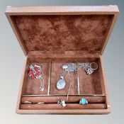 A jewellery box containing silver jewellery, engraved heart locket,