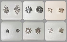 A collection of various diamante stud earrings.