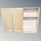 A contemporary pine double door cabinet together with similar bookshelves