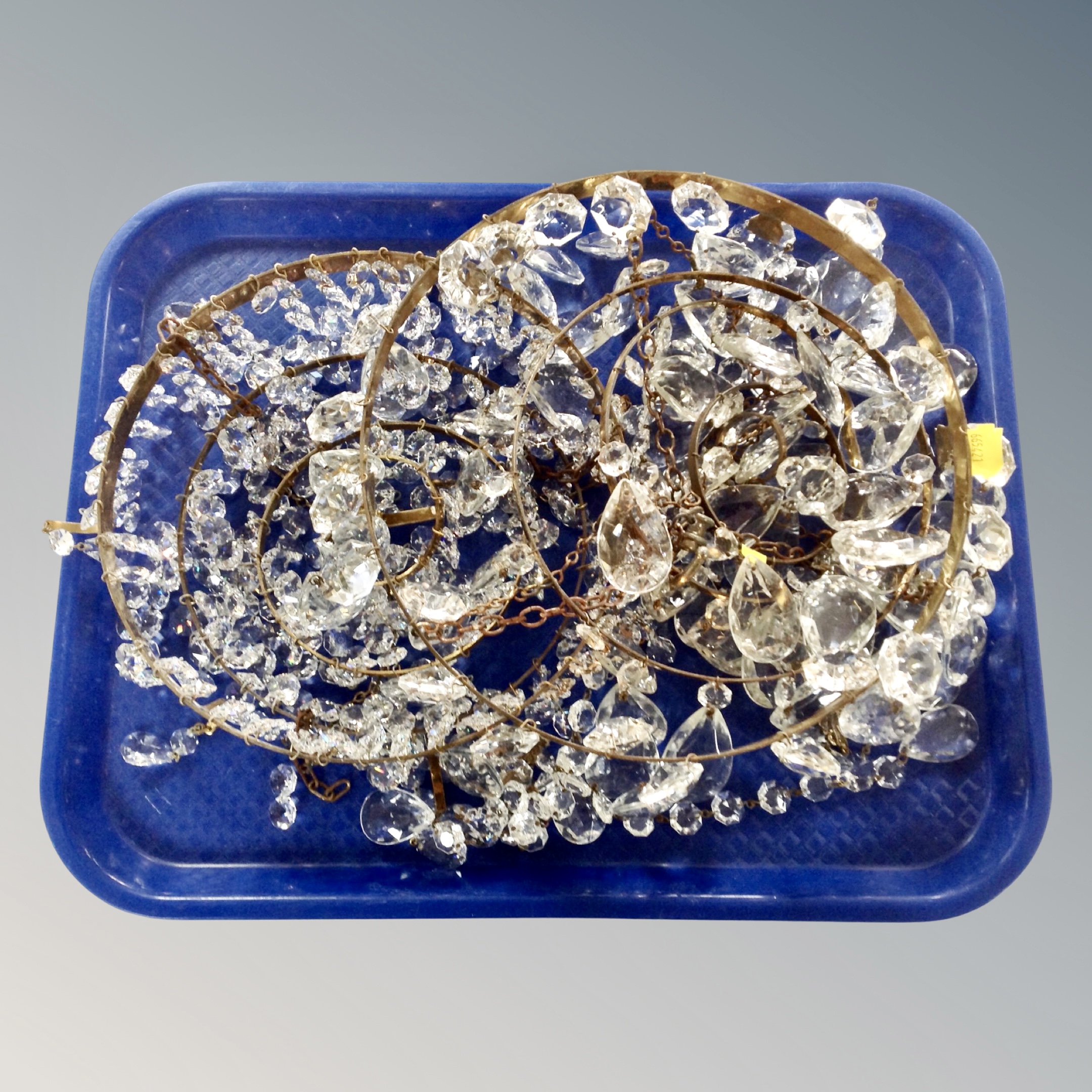 A tray of two vintage brass and crystal pendant lights