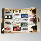 A box containing die cast vehicles, classic cars.