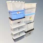 11 plastic storage boxes with lids.
