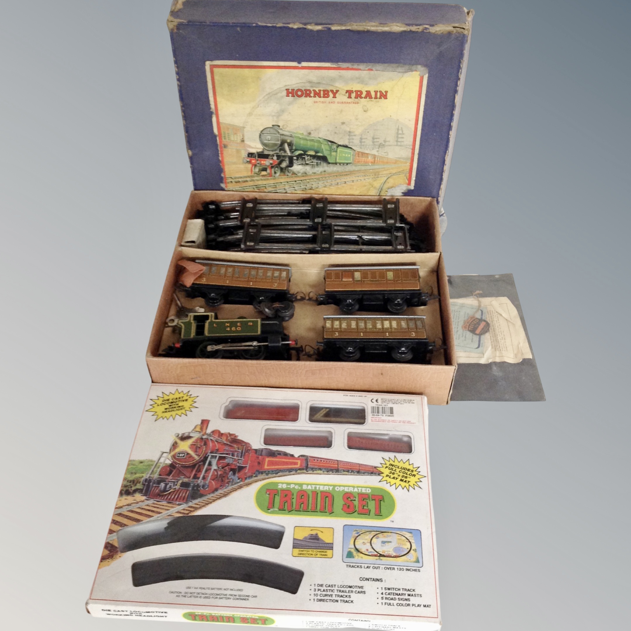 A Hornby tin plated OO gauge clockwork train set.