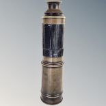 A four draw brass telescope with dust cap and closure