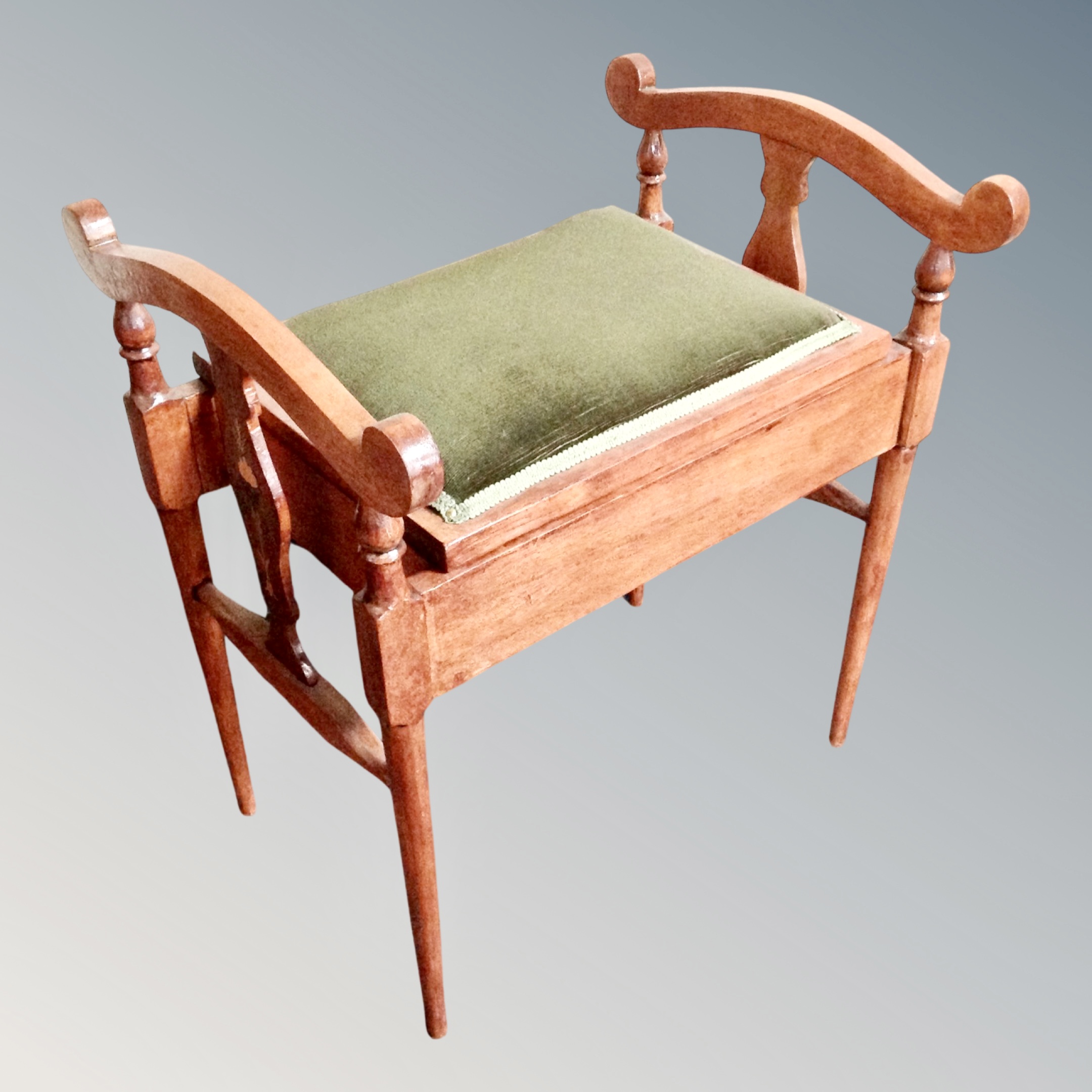 A stained beech piano stool.