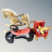 A Mama's and Papa's soft toy rocking horse, together with a BMW ride on car,
