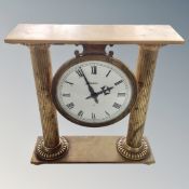 An Angelus brass Corinthian column mantle clock