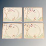 A set of four Clarice Cliff rectangular cabinet plates, each 7 cm x 4 cm,