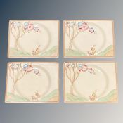 A set of four Clarice Cliff rectangular cabinet plates, each 7 cm x 4 cm,