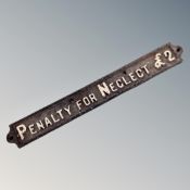 A cast iron sign - Penalty for Neglect £2