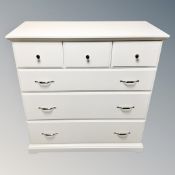 A contemporary six drawer chest together with similar bookshelves (white)