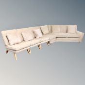 A mid-century three seater button back corner settee upholstered in a dralon fabric,