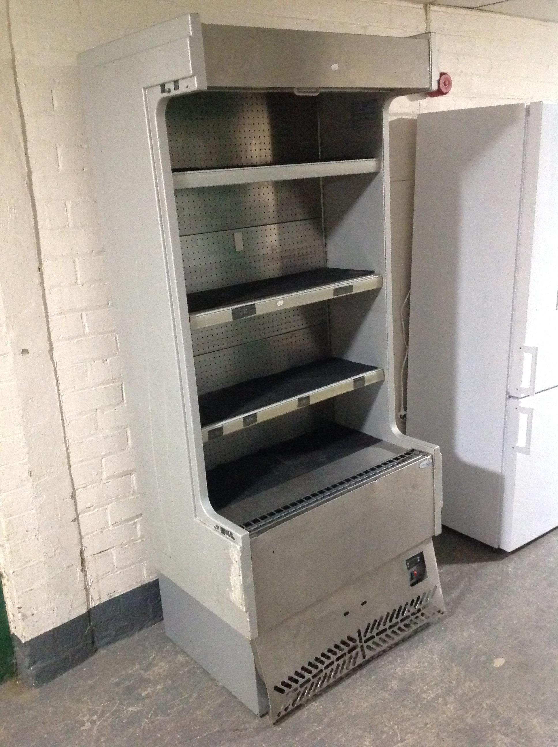 An Interlivin stainless steel refrigeration shelving unit with pull-down shutter door.