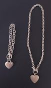 A silver toned heart necklace and bracelet measuring 8.5 inches (length) and 4.5 inches (length).