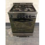 A Baumatic stainless steel commercial four burner gas cooker.
