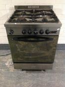 A Baumatic stainless steel commercial four burner gas cooker.