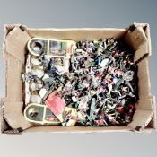 A box containing a large quantity of mid-century lead and metal soldier figures.