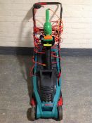 A Bosch Rotak 34 electric lawn mower with grass box,