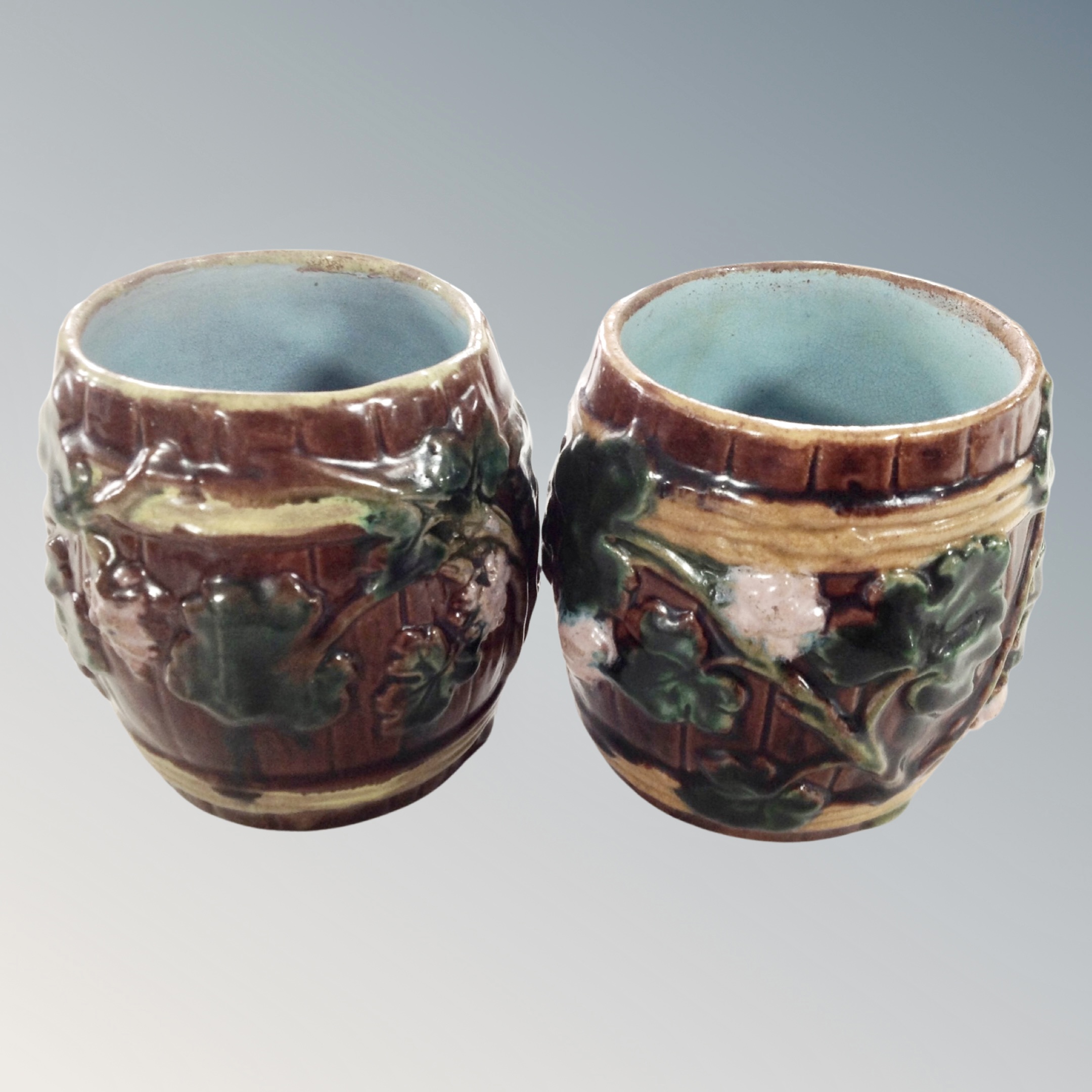 A pair of antique Majolica barrel pots.