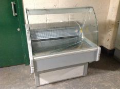 A shop refrigerated display cabinet with marble counter.