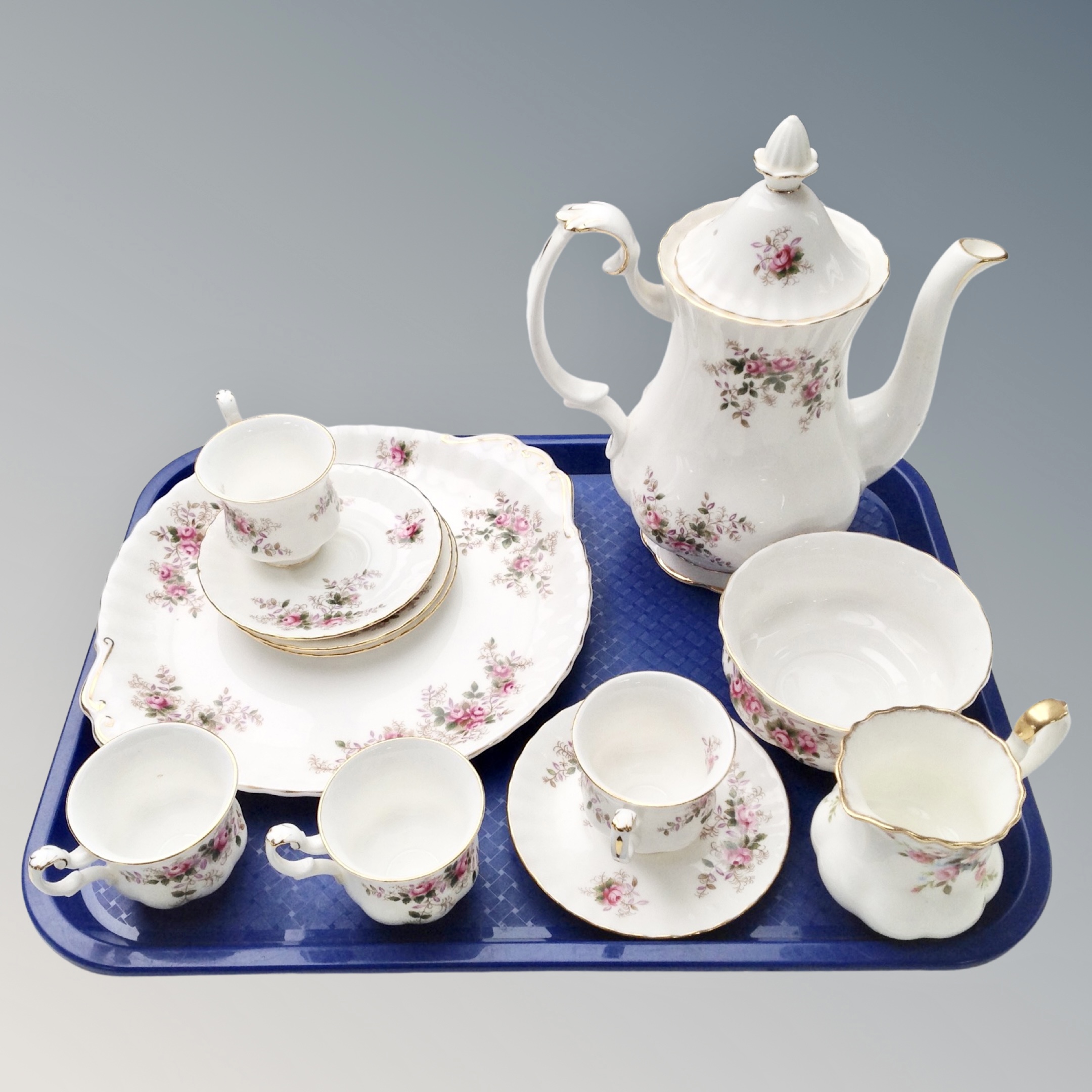 A tray containing a Royal Albert Lavender Rose part china tea set.