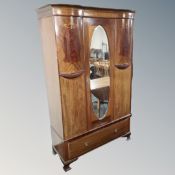 A Victorian inlaid mahogany wardrobe with drawer beneath