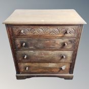 A 20th century carved oak two drawer dressing chest on raised legs together with matching four