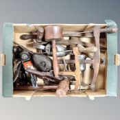 A box containing a quantity of vintage hand tools, oil lamps, Stanley woodworking planes etc.