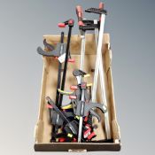 A box containing assorted clamps.