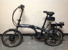 A Harrier Eco Power Assisted electric bike with manual and charger.
