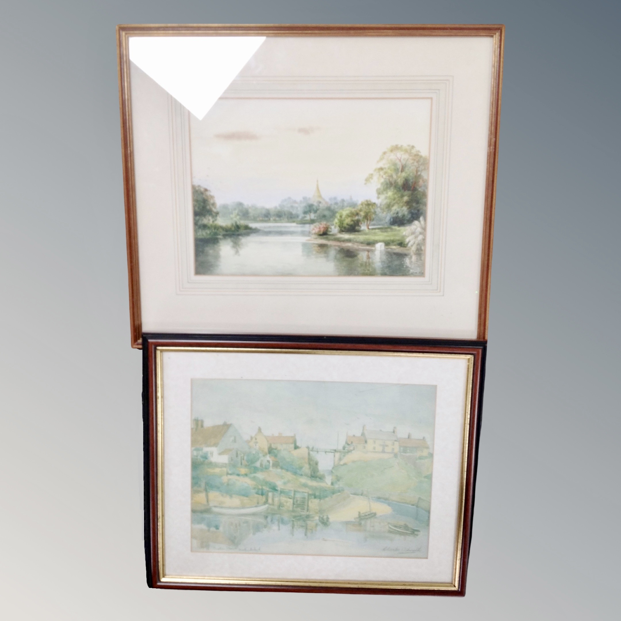 A 20th century watercolour study of figures on a lake with trees beyond,