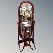 A hardwood wig stand fitted with two drawers, together with a cheval mirror.