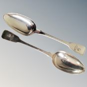 A pair of George III London silver serving spoons.