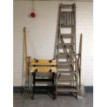 A set of folding wooden garden steps together with four garden tools and a folding work bench.