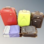 Five assorted fabric and hard shell luggage cases including Antler, IT luggage etc.