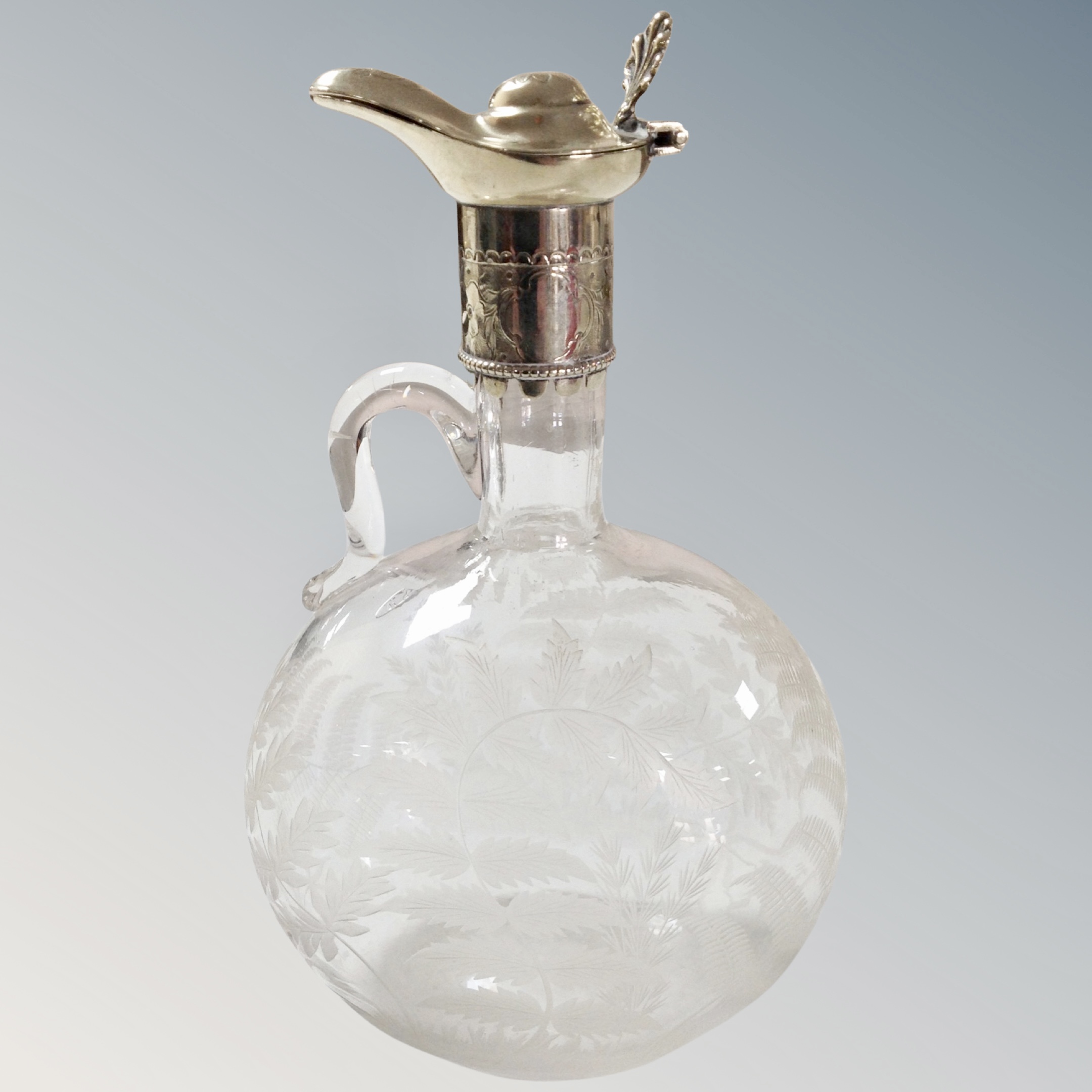 An etched glass and silver plate mounted decanter.